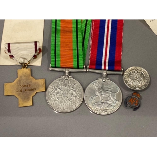 14 - WWII medals & paperwork includes the British Red Cross society, defence medal & war medal, all with ... 