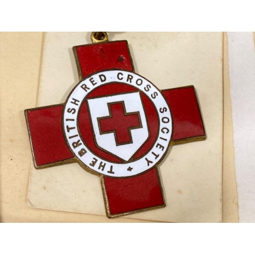 14 - WWII medals & paperwork includes the British Red Cross society, defence medal & war medal, all with ... 