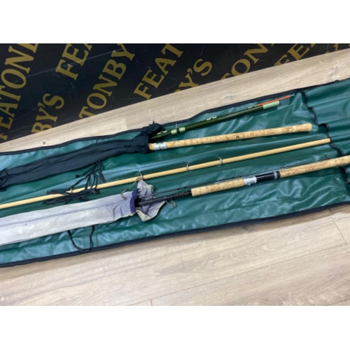 237 - Pair of vintage fishing rods, in protective cover