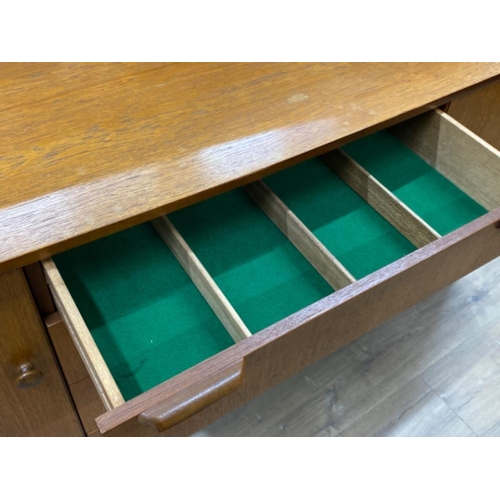 403 - Mid century Danish teak low sideboard fitted with 4 drawers & shoulder cupboards