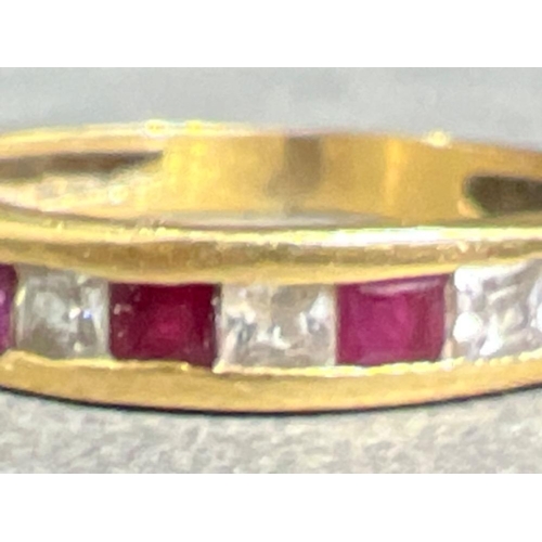 56 - Ladies 18ct gold Ruby and diamond band ring. 2g size L1/2