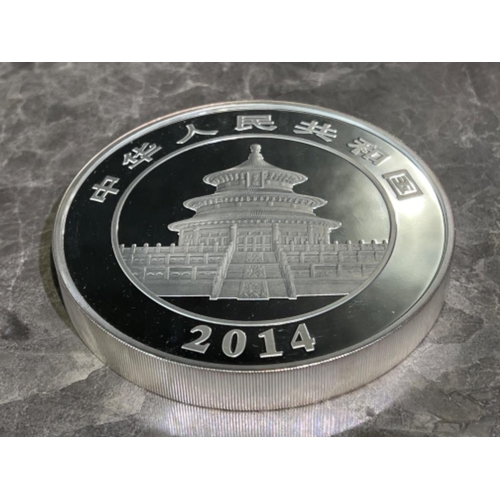 58 - 2014 Panda 1kilo solid silver coin with certificate and presentation case.