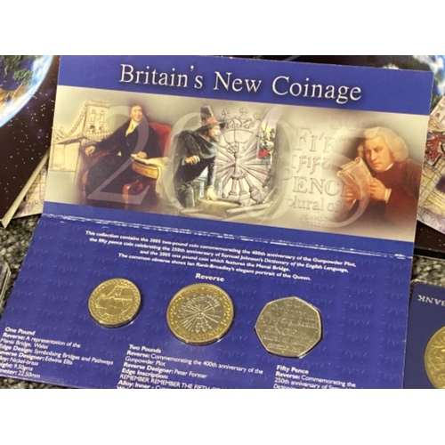 113 - 2x Millennium “2000” five pounds coins & Britains 3 piece new coinage set, all issued by Royal Mint ... 