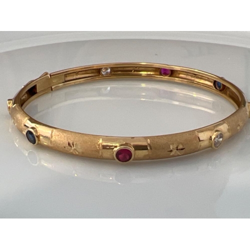 141 - Beautiful 18ct gold multi coloured stone bangle. 8.2g - This will be available for collection from 2... 