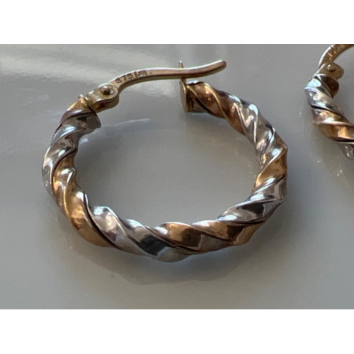 149 - Ladies 9ct white and yellow gold hoop twist earrings. 1.8g - This will be available for collection f... 