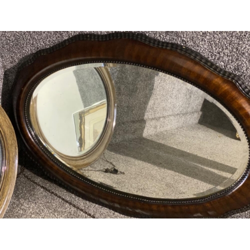 229 - 2x vintage mahogany framed oval shaped bevelled edge mirrors - 58x49cm & 83x56cm