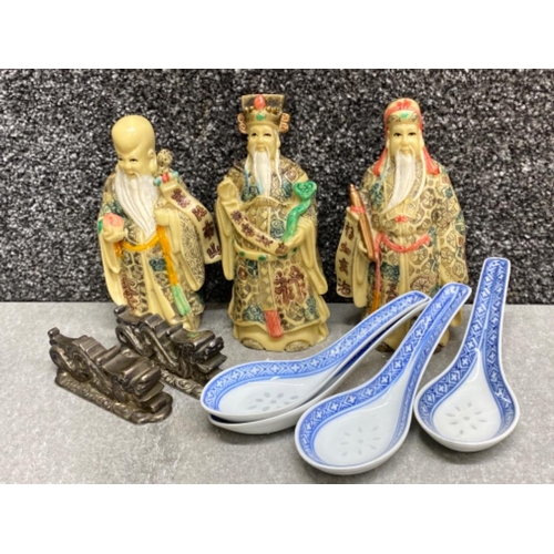 25 - Oriental lot comprising of 3 Chinese figures, pair of metal “foo dragon design” chopstick holders an... 