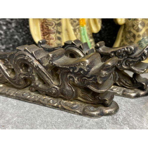 25 - Oriental lot comprising of 3 Chinese figures, pair of metal “foo dragon design” chopstick holders an... 