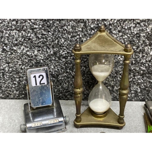 301 - Mixed lot comprising of vintage desk Calendar, brass & glass hour glass plus a selection of pocket k... 