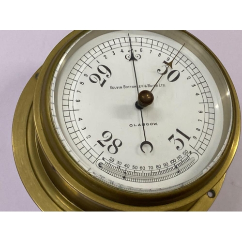 357 - Kelvin.Bottomley & Baird Ltd circular shaped brass marine barometer