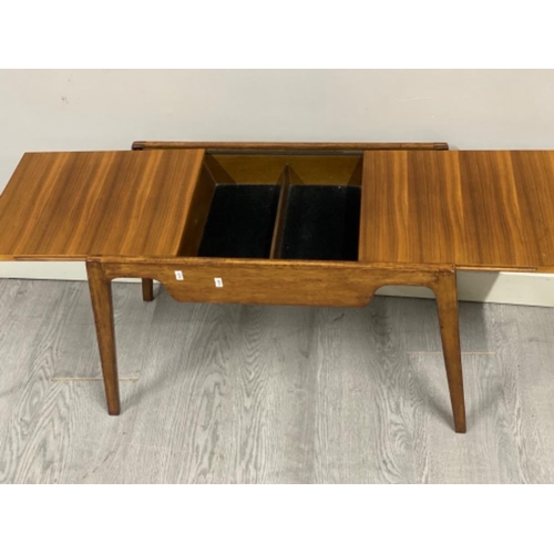 377 - Teak sliding top storage table