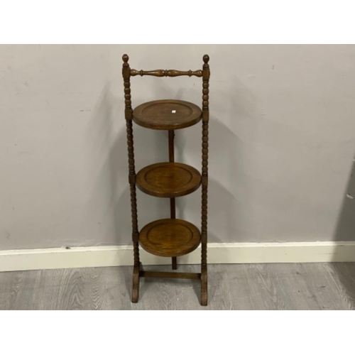 379 - Antique solid oak 3 tier folding cake stand with bobbin uprights