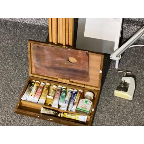 44 - Box containing wooden 2 in 1 artist easel storage box with paints, plus a contemporary desk lamp