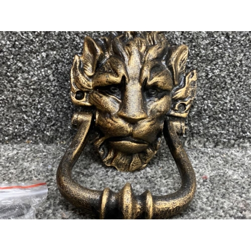 73 - A reproduction cast metal 10 Downing Street knocker in the form of a lion