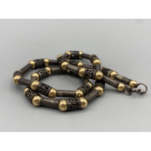 61 - Silver and silver gilt bead necklace, 42cm