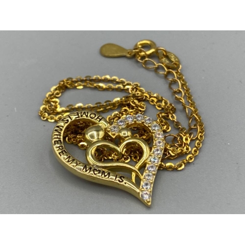 63 - Silver gilt heart shape pendant & chain, heart inscribed “home is where my mum is” with CZ stones, 4... 