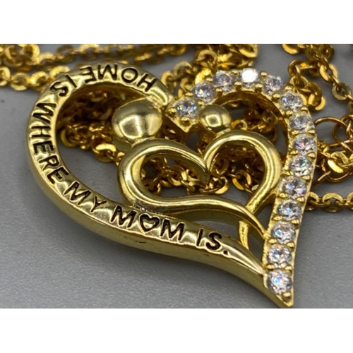 63 - Silver gilt heart shape pendant & chain, heart inscribed “home is where my mum is” with CZ stones, 4... 