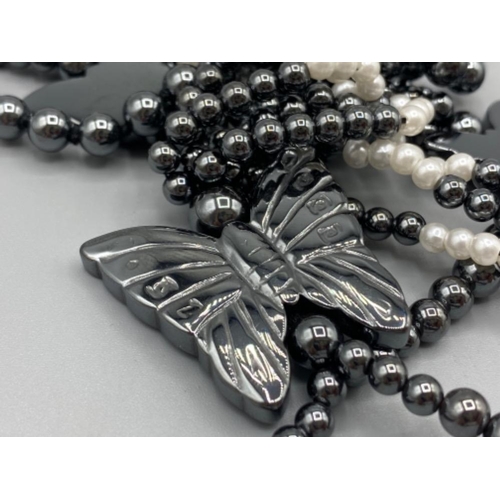 64 - Haematite, pearl butterfly shaped pendant necklet and Haematite and silver bead necklet