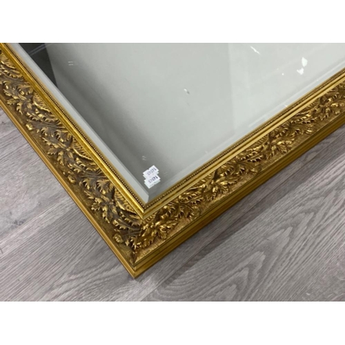 83 - Large gilt framed bevelled edge mirror, 115x90cm