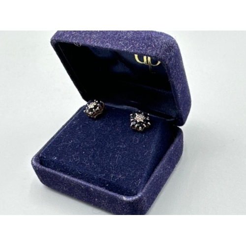 103 - 9ct gold diamond & sapphire cluster stud earrings - comprises of 1 diamond surrounded by 8 sapphires... 