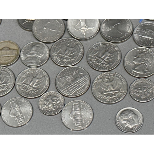 210 - Tub containing a large quantity of coins including USA quarter Dollar & 1 Dime coins etc