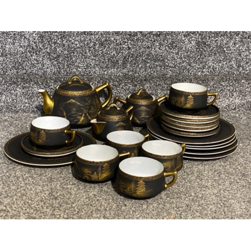 220 - A collection of mount Fiji tea set in black and gold