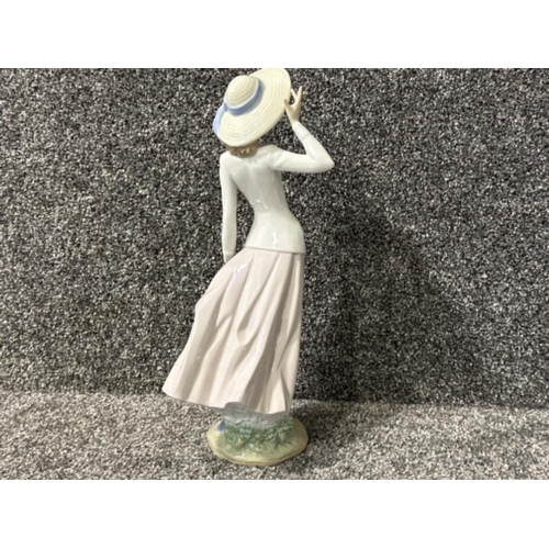 245 - Lladro figure 5683 breezy afternoon in good condition