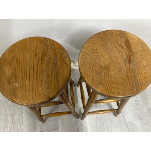 394 - Pair of vintage oak circular seated kitchen high stools