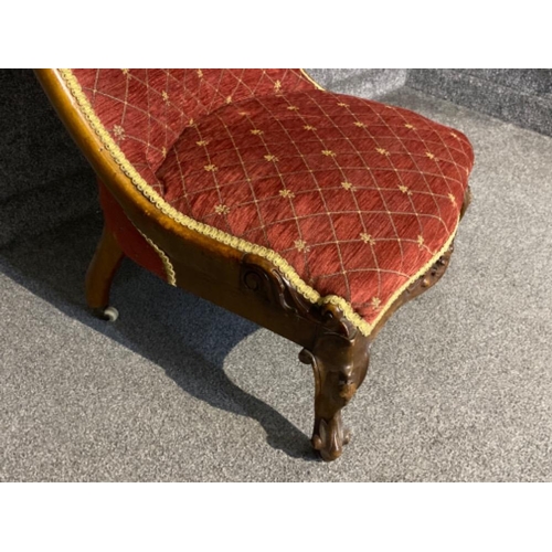 73 - Heavily carved mahogany framed nursing chair with cabriole legs & claw & ball feet, upholstered with... 