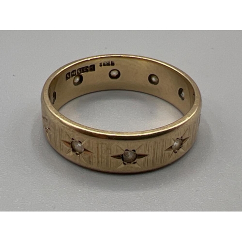 50 - 9ct gold hallmarked band with white stones, size Q (4.05g)