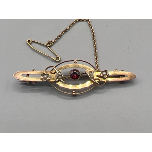 58 - Ladies Antique 9ct yellow gold Seed Pearl and Ruby brooch with chain weighing 2.65 grams gross in bo... 