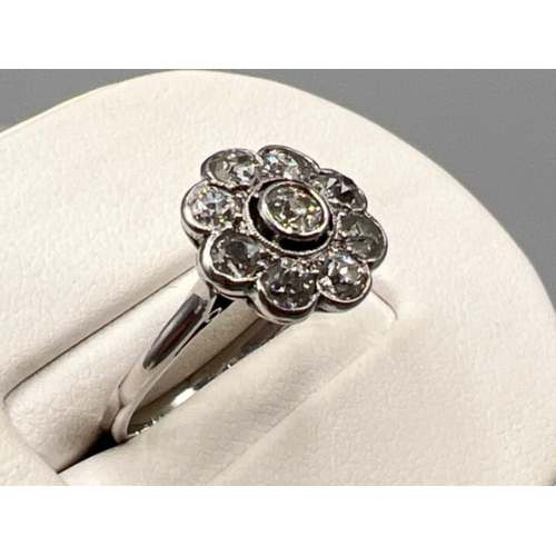 106 - Ladies 18ct white gold diamond flower cluster ring, size N1/2 (2.97g)