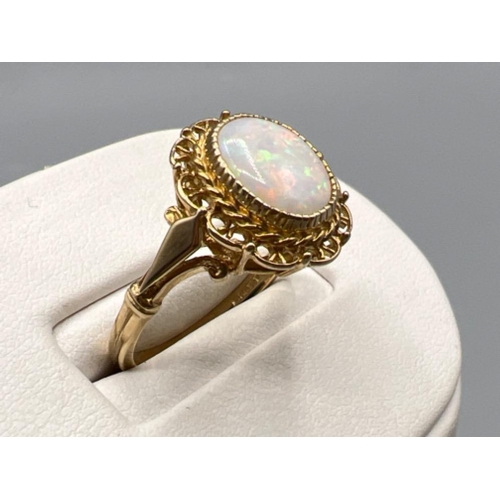 86 - Ladies 18ct gold fancy patterned opal ring, size R (3.92g)