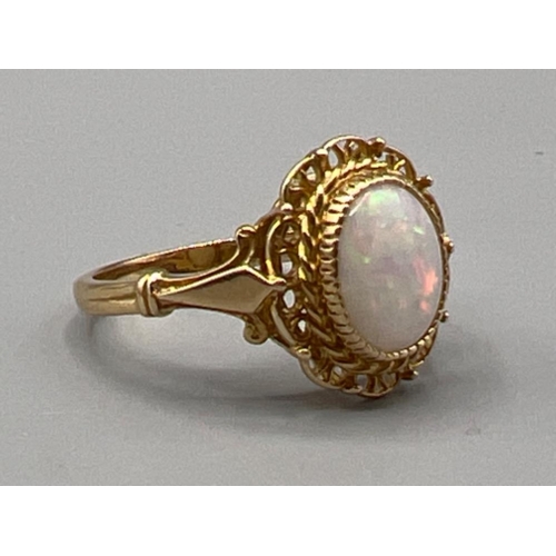 86 - Ladies 18ct gold fancy patterned opal ring, size R (3.92g)