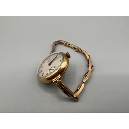 118 - Ladies 9ct gold wristwatch by J.W Benson London