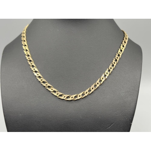 121 - Gents 9ct gold 66cm flat curb double belcher chain (25.74g)