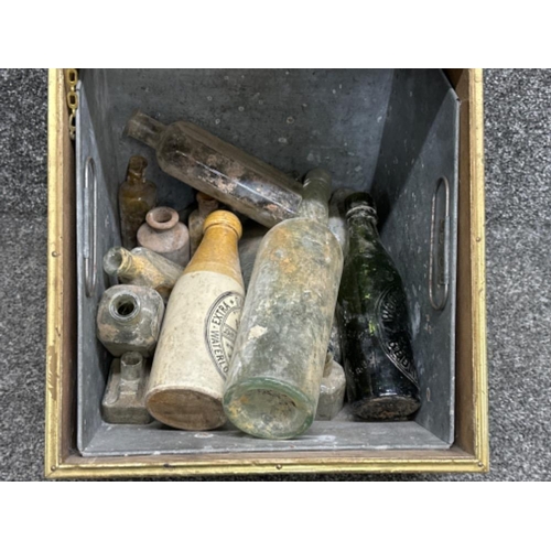 19 - Vintage brass coal scuttle with shovel containing a mixture of antique glass bottles