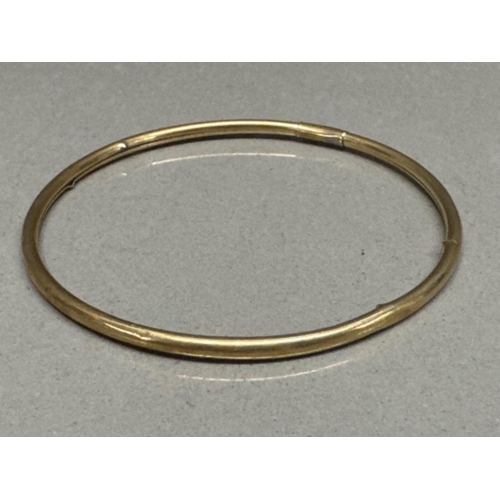 54 - 9ct yellow gold slave bangle - 3.9g