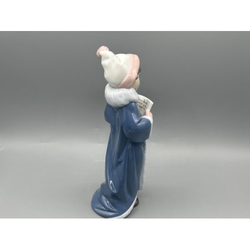 11 - Lladro 6533 ‘The Christmas Caroler’ in good condition and original box