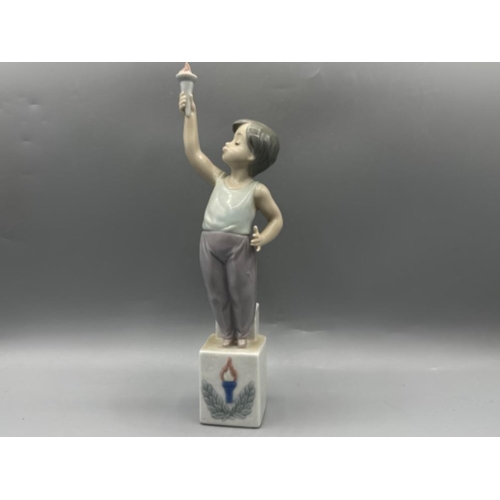 127 - Lladro figure 5870 Olympic Torch, good condition, height 25cm