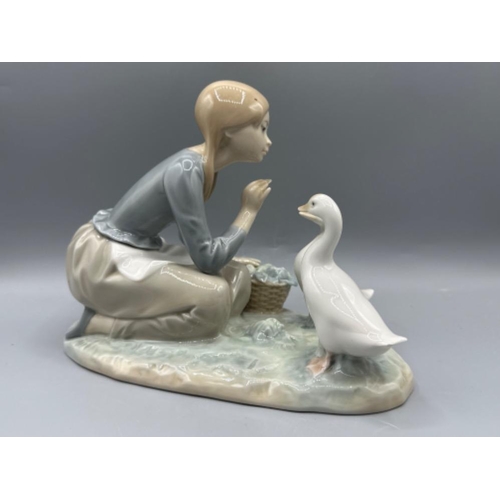 131 - Lladro figure 4849 Food For Ducks, good condition, height 17.5cm