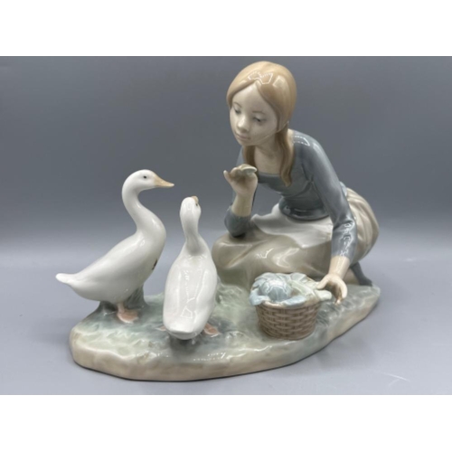 131 - Lladro figure 4849 Food For Ducks, good condition, height 17.5cm