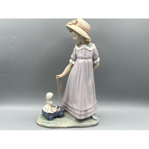 138 - Lladro figure 5044 Girl With Toy Wagon, good condition, height 28cm