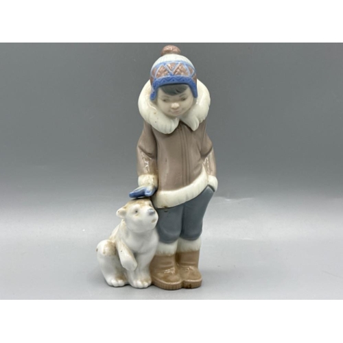 142 - Lladro figure 5238 Eskimo Boy With Pet, good condition, height 15cm