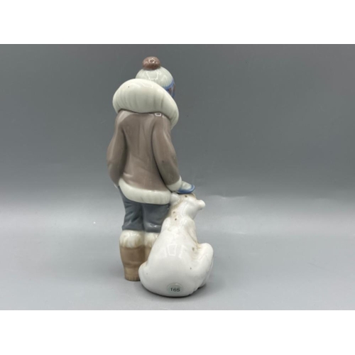 142 - Lladro figure 5238 Eskimo Boy With Pet, good condition, height 15cm