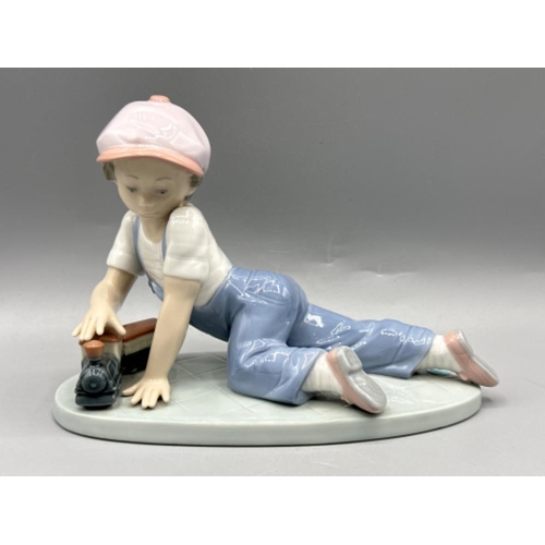 144 - Lladro “1992 Collectors Society” figure 7619 All Aboard, good condition, H13cm X W18cm