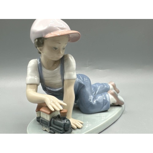 144 - Lladro “1992 Collectors Society” figure 7619 All Aboard, good condition, H13cm X W18cm