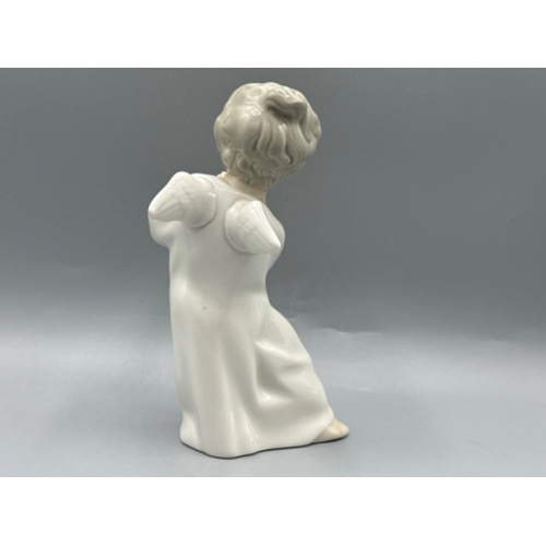 169 - Lladro figure 4540 Angel Playing Flute, good condition, height 16cm