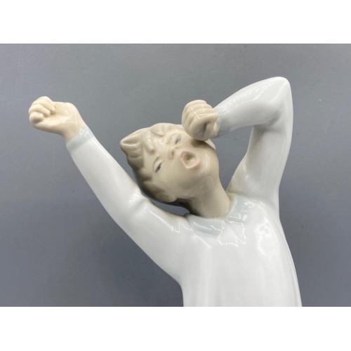 182 - Lladro figure 4870 Boy Yawning in good condition - height 21cm