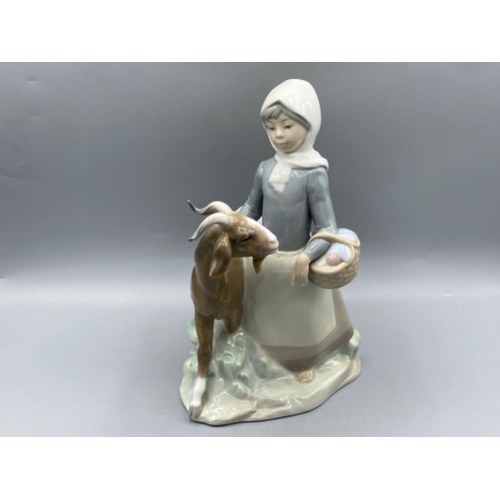 201 - Lladro 4812 ‘Girl with Goat’ in good condition - height 22.5cm